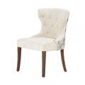 Sillón Tulip deoupe, asiento y respaldo acolchados con patas de metal, estilo moderno y elegante en color blanco.