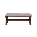 Banca Ikaro de comedor de madera con asiento acolchado en color gris, estilo moderno y patas de madera natural.