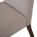 Silla de comedor Ikaro en color gris, con diseño moderno y respaldo ergonómico, ideal para comedor elegante.