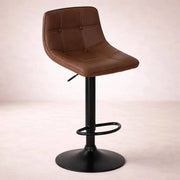 Banco para barra de acero con asiento de madera termoformada y tapizado en Leather Touch, de color café, altura 50 cm.