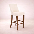 Banco para barra de nogal beige deurope.com.mx, con tapizado en tela, frente de 46 cm, altura 112 cm y fondo 45 cm.