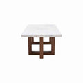 Mesa de centro Kaori de Deurope con superficie de mármol veneciano, estructura de nogal y dimensiones de 110x45x70 cm.