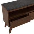 Mueble de TV Montecarlo de estilo moderno, en color madera clara, con espacio para dispositivos electrónicos y almacenamiento.