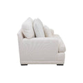 Sillón Oliver de color blanco con tejido plano y textura afelpada, con dimensiones de 123 cm de alto, 97 cm de ancho y 107 cm de fondo.