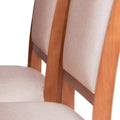 Juego de comedor Siena de nueve piezas con sillas de madera en color café almendra y tapizado de cuero en estilo moderno.