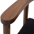 Silla de comedor Montecarlo en color café con tapizado de tela de poliéster, estructura resistente y diseño moderno.