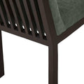 Sillas del conjunto de comedor Quetzal de 7 piezas, en color gris, con estructura de madera y asiento acolchado.