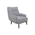 Sillón Andrea Berlin de tapiz gris, con respaldo y asiento acolchado, en una sala moderna.