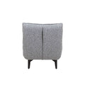 Sillón Andrea Berlin gris de tapiz en tela, vista frontal, con respaldo y asiento acolchado, en un entorno moderno.