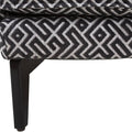 Sillón Andrea Essa de tapiz negro, con respaldo y asiento acolchados, para sala o comedor, en imagen de frente.