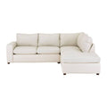 Sofá sala Gracey con chaise de Deurope, tapizado en tela gris, con cojines decorativos y estructura moderna.