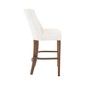Banco para barra Berne Made de madera nogal beige con tapizado en tela, 46 cm de alto, 112 cm de largo y 45 cm de fondo.