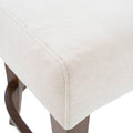 Banco para barra Berne Made deurope.com.mx con tapizado en tela, acabado en nogal beige, frente de 46 cm, altura 112 cm.
