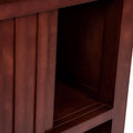 Librero con puertas Quebec de madera de nogal, encino y okumé, en acabado natural, de aproximadamente 100 cm de alto y 180 cm de ancho.