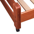 Cama baja Tennesse de madera de pino con acabado nogal, con estructura sólida y diseño moderno para dormitorios infantiles.