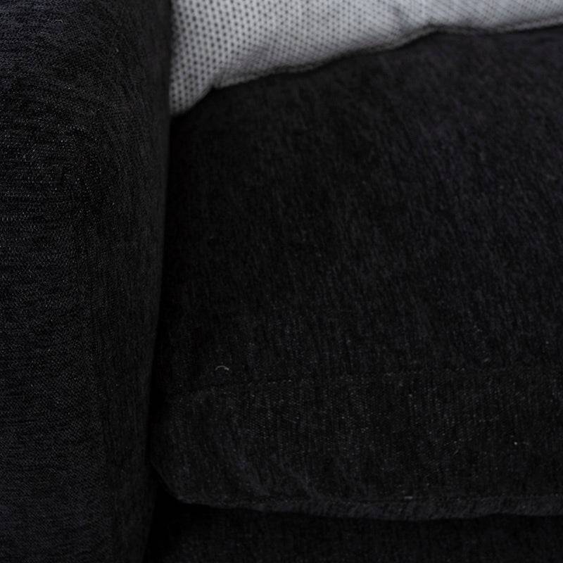 Módulo de sala Lazy Loveseat en tela negra, con estructura moderna y respaldo acolchado, vista frontal en ambiente de sala.