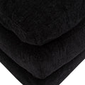 Módulo de sala Lazy Chaise de cuero negro con cojines, parte frontal, de aproximadamente 95 cm de alto y 174 cm de fondo.