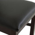 Juego de comedor Aragón de 8 piezas con sillas de madera nogal y asiento de heno, en un entorno elegante.