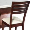 Juego de comedor Quetzal de 9 piezas con sillas de madera de pino enchapada en caoba y tapizado en Leather Touch.