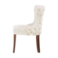 Sillón Tulip de madera con tapizado en chenille en color nogal, estructura de madera y diseño elegante.