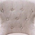 Sillón Tulip de madera y tapizado en chenille, estructura en nogal, con asiento y respaldo cómodos y diseño elegante.